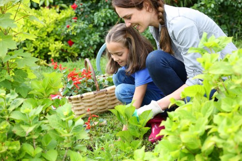 Gardener reviewing service terms before carrying out outdoor work